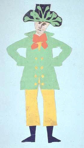 Человек в зеленой куртке, желтых штанах, с красным шейным платком, в большой темно-синей шляпе с зеленым узором из листьев